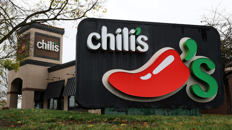 Signage is situated outside a Chili's restaurant.