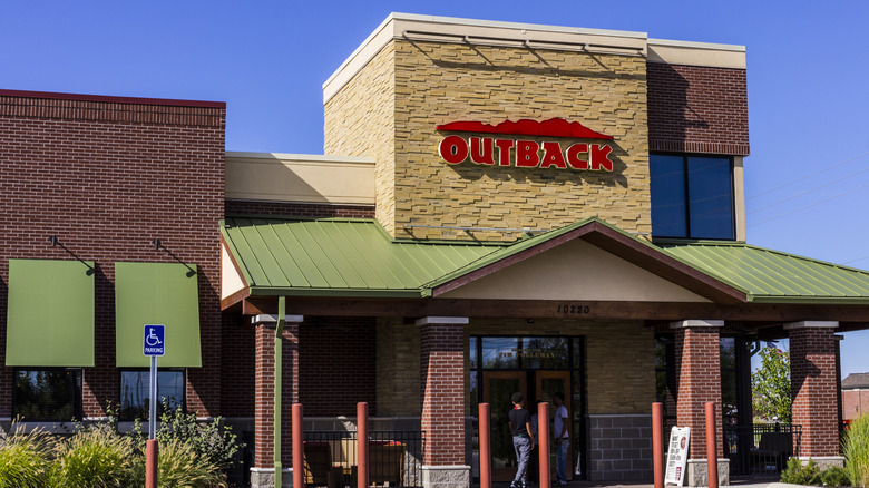 Customers enter an Outback Steakhouse.