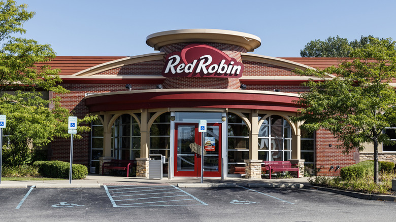 Parking spots remain empty outside a Red Robin.