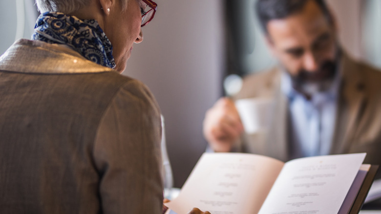 Couple reading a menu