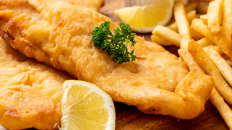 fish and chips on wooden platter