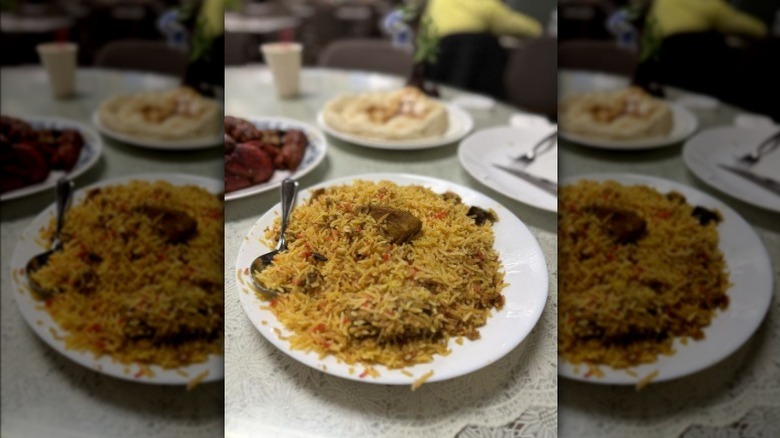 A plate of biryani rice on a white table at Kabab King in Queens, New York