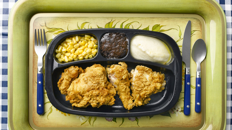 Retro TV dinner tray with various foods