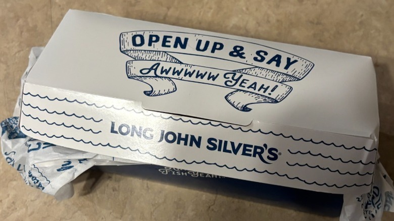 A close up of a closed Long John Silver's branded box, reading 