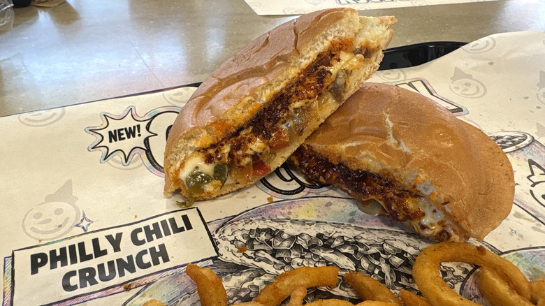 A Philly Chili Crunch Cosmic Jack cut in half on a plate