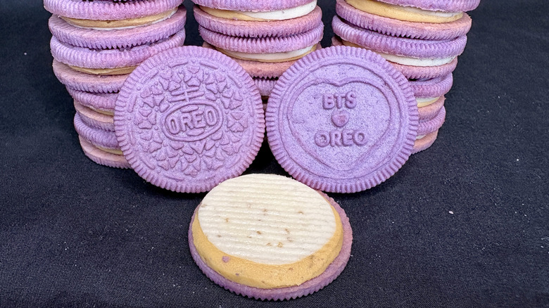 Stack of purple BTS Oreos with open cookie in front