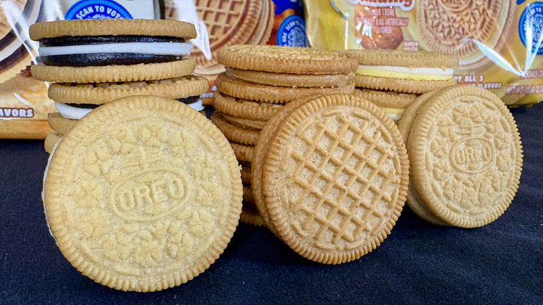 Three stacks of different flavor Oreos with packages in background
