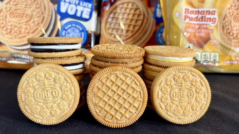 Three stacks of different flavor Oreos with packages in background