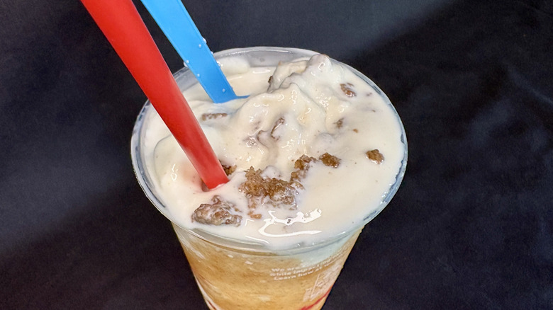Wendy's frosty with blue spoon and red straw