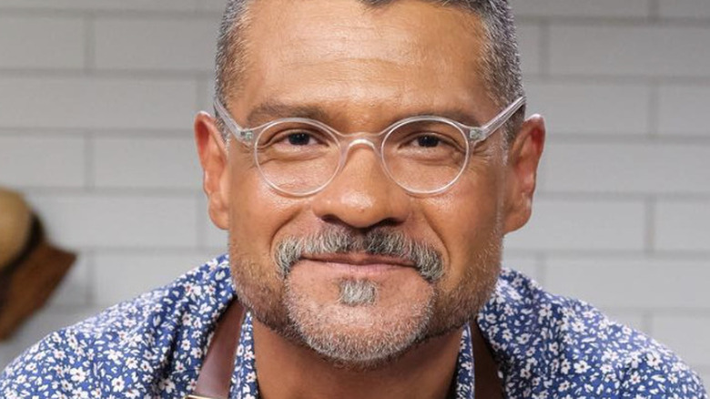 Rick Martinez posing in kitchen