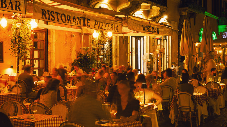 Dining outside at night in Rome, Italy