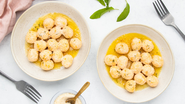 two plates of ricotta gnudi