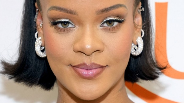 Rihanna with hair down and slight smile
