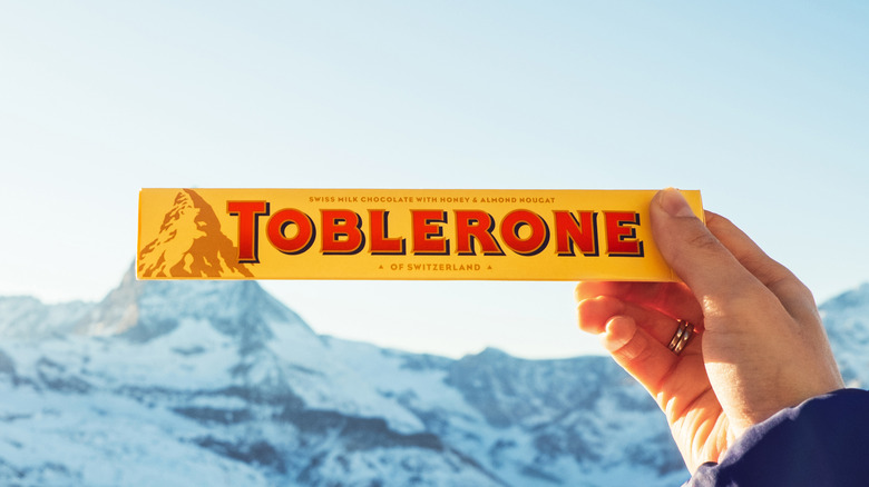 hand holding tolberone candy 
