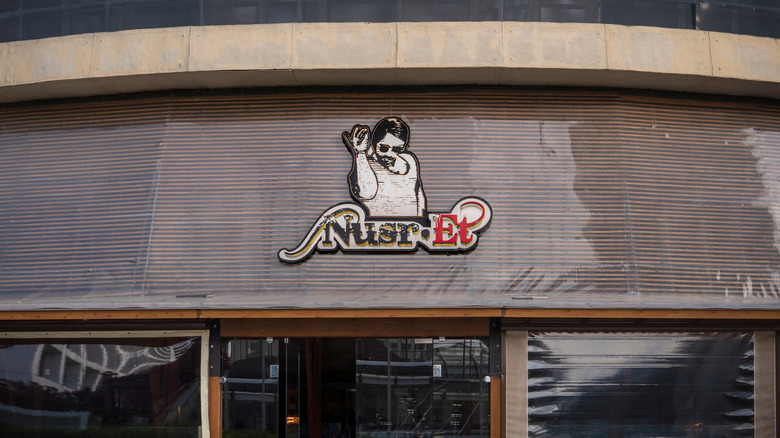 A closeup of the logo on the facade of a Nusr-Et Steakhouse
