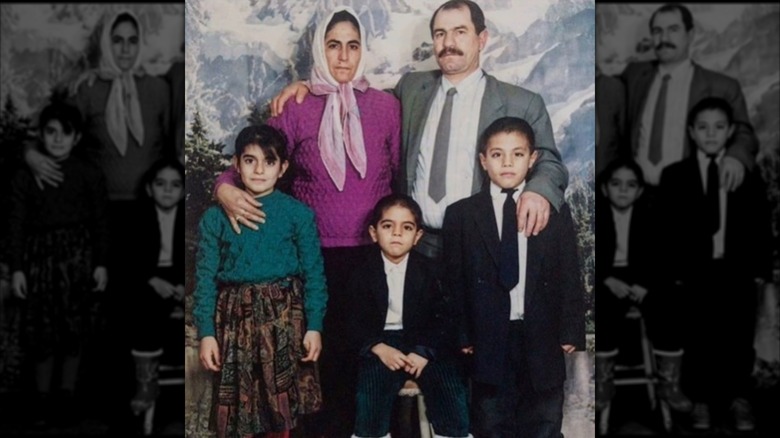 An old photo of a young Nusret Gökçe, also known as Salt Bae, with his family