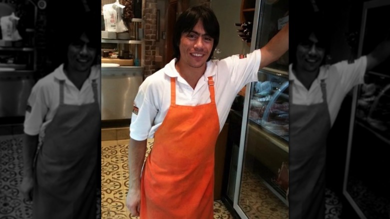 An old photo of Nusret Gökçe, also known as Salt Bae, wearing an apron at work
