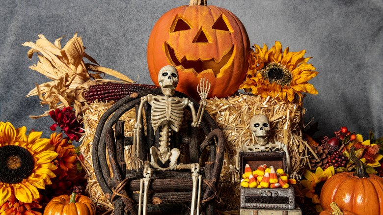 Skeleton, pumpkin, and haystack