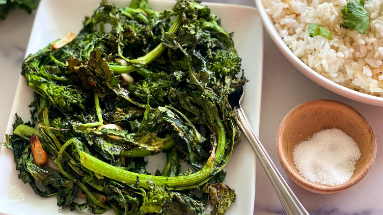 roasted broccoli rabe on plate with fork