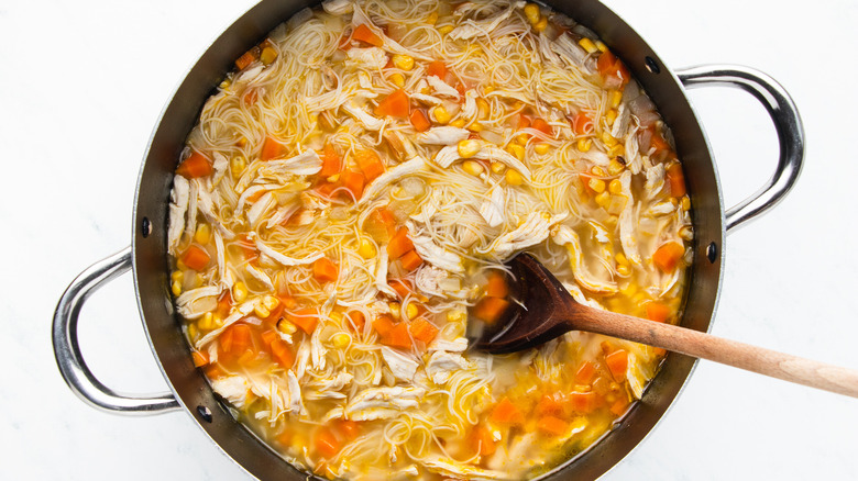 Chicken corn noodle soup in pot