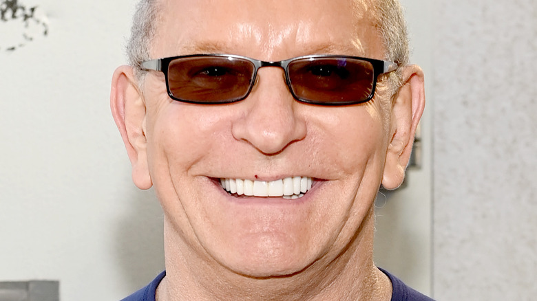 Robert Irvine smiling with glasses