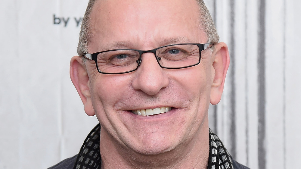 Robert Irvine smiling with glasses