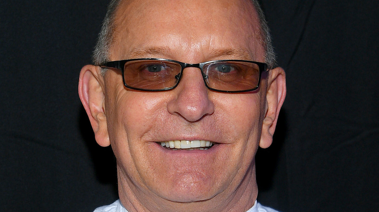 Robert Irvine smiling with glasses