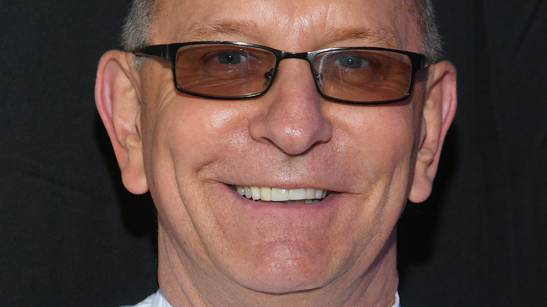 Robert Irvine smiling and wearing sunglasses