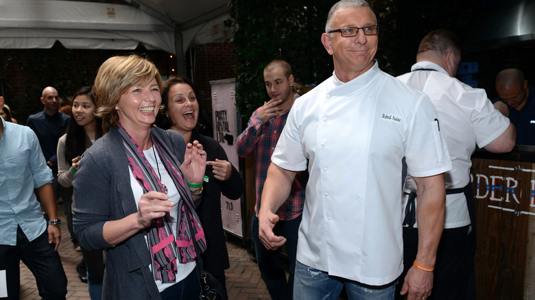 Robert Irvine and others smiling and laughing