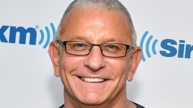 Robert Irvine smiling in glasses