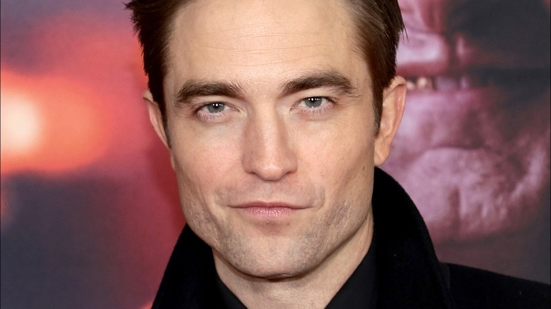 robert pattinson smirks