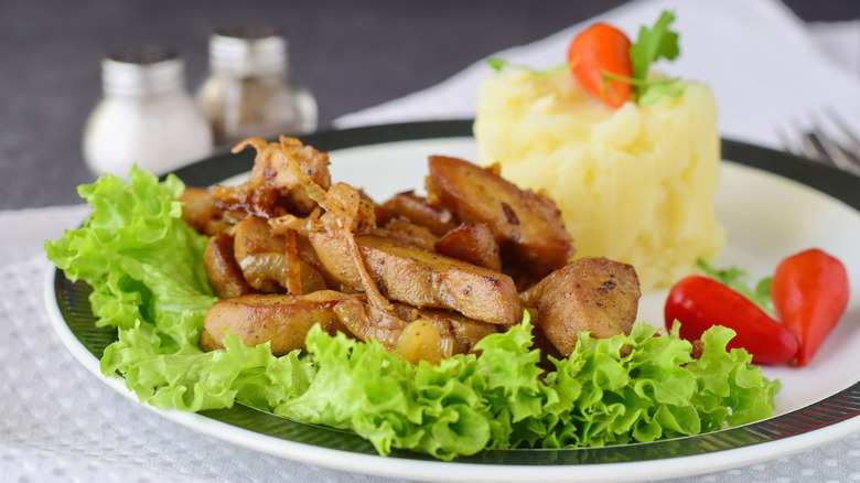 Fried bull testicles served with mashed potato.