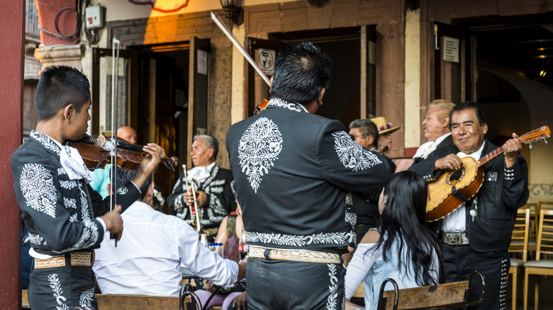 Mariachi band plays in restaurant