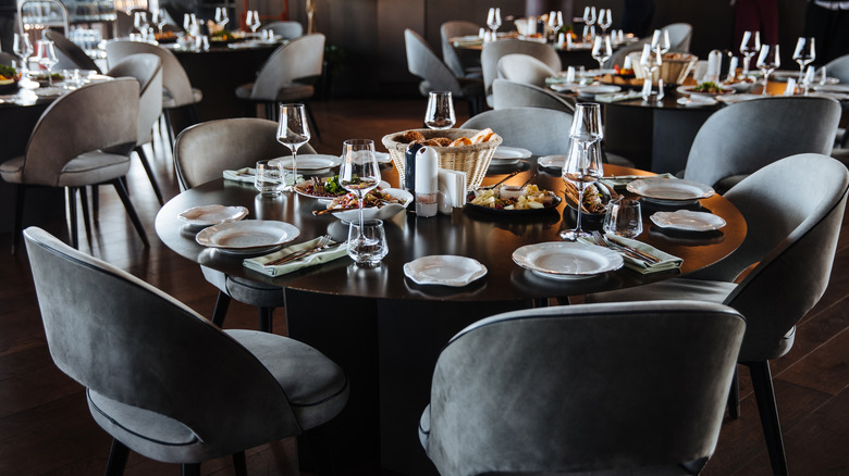 An elegant dinner table in a restaurant filled with food