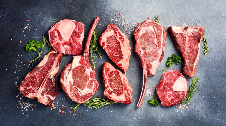 variety of raw steaks