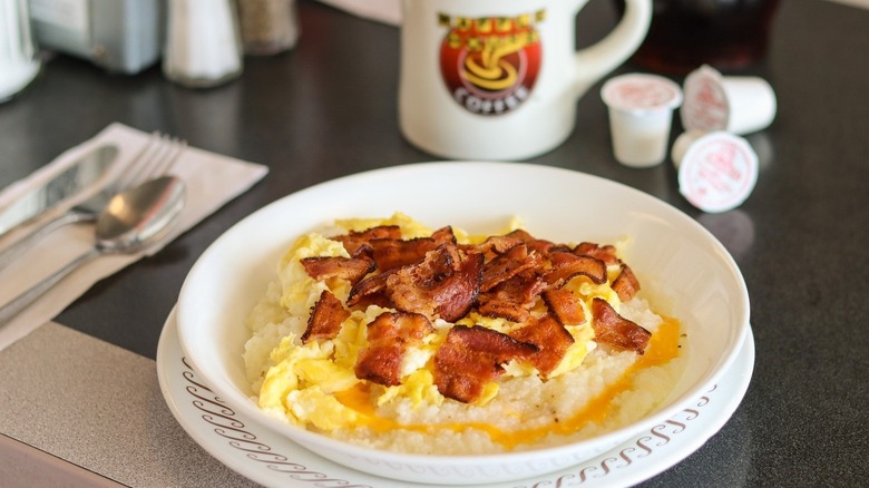 A bowl of Waffle House bacon and egg grits