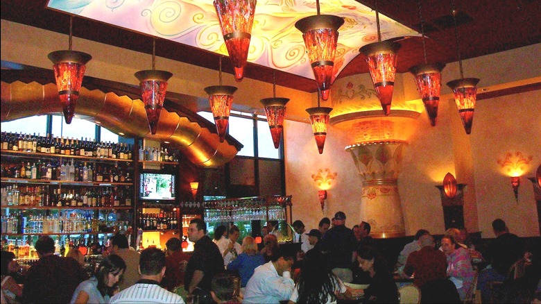 The Cheesecake Factory bar crowded with customers.