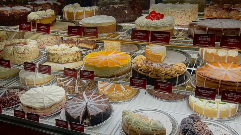A display of various cheesecake varieties at the Cheesecake Factory.