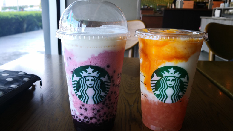 Pair of colorful Starbucks drinks