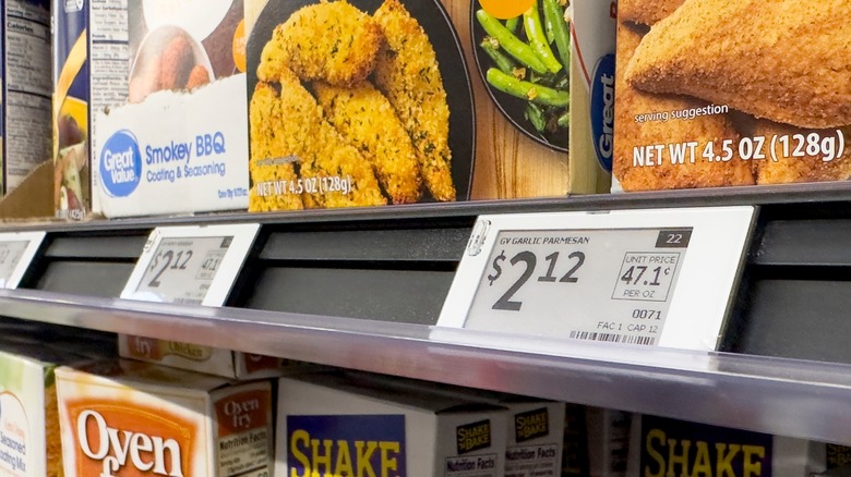 A shelf at the grocery store showing the price tags with the cost per ounce