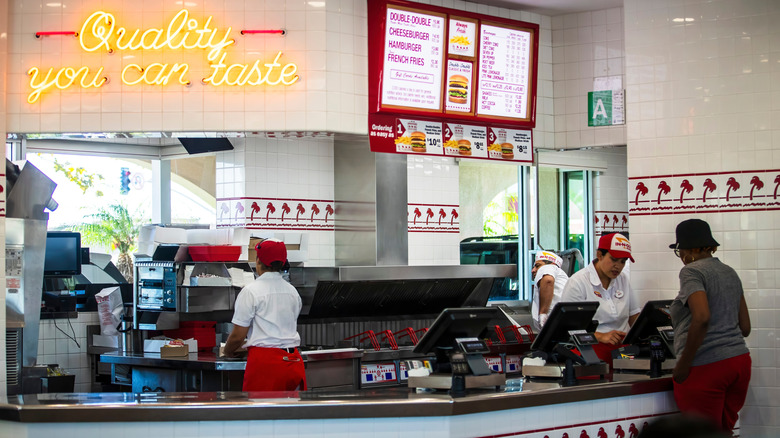 Woman ordering at an In-N-Out counter