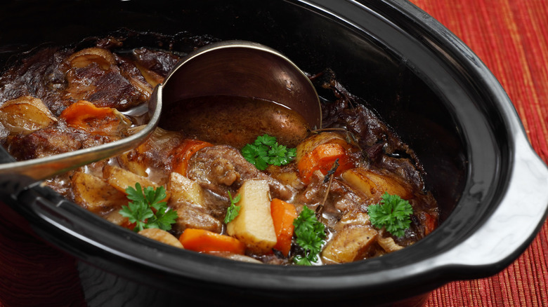 Beef stew cooking in a slow cooker