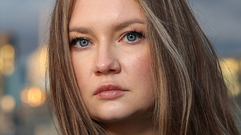 Anna Delvey with cityscape background