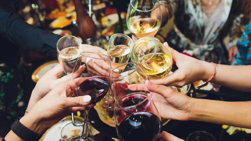 People holding wine glasses