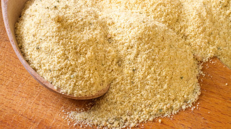 Chicken stock powder on wooden surface