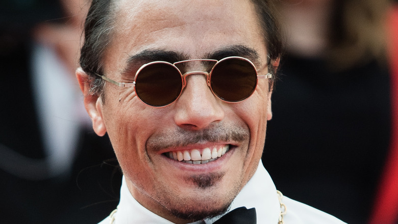 Salt Bae smiles while attending event