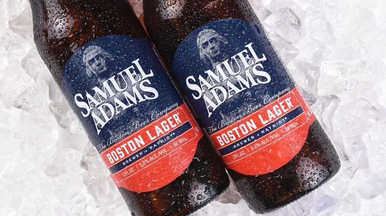 Two cold bottles of Sam Adams Boston Lager on ice