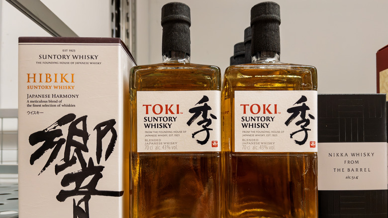 Bottles of Suntory-brand Toki whisky on store shelf.