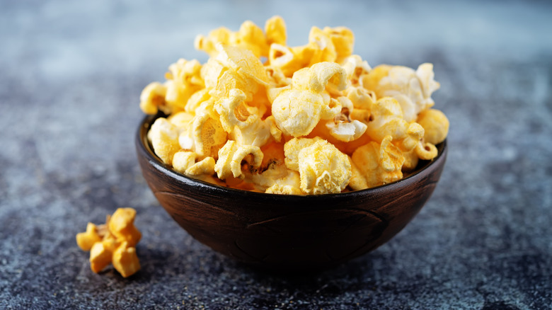 yellow popcorn in wooden bowl