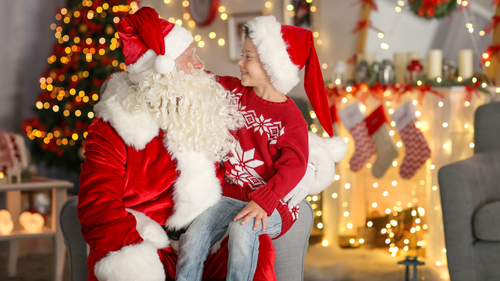 Little boy sitting on Santa's lap